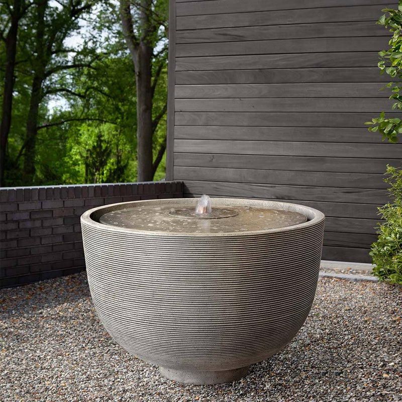 Campania International Alta Girona Fountain is stained in Alpine Stone, a calming color for the garden.